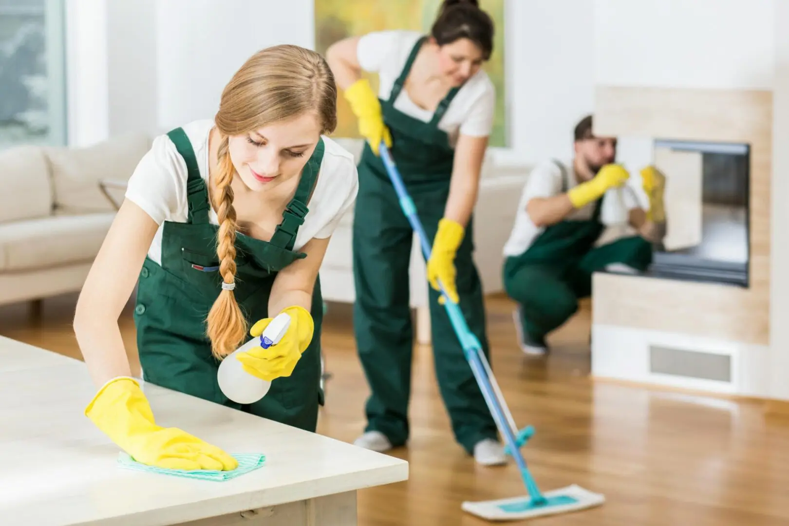 Cleaning crew tidying a modern living room.