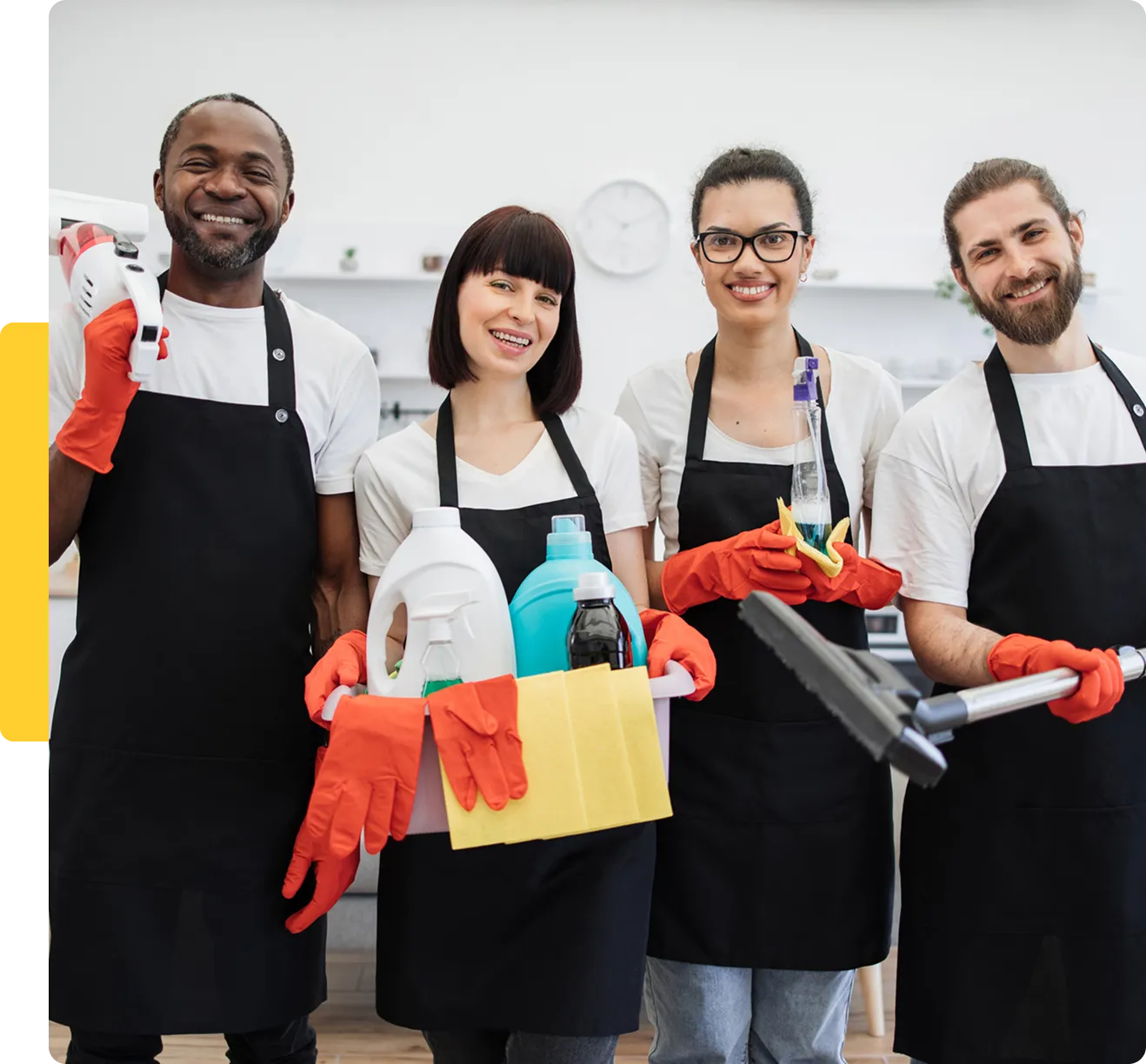 Cleaning team holding supplies, smiling together.